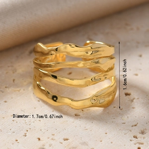 Detail view of gold wave ring showing 1.6cm height and hammered metal texture