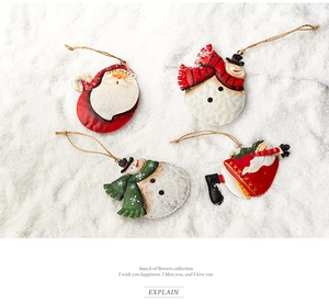 Set of four vintage metal Christmas ornaments with Santa and Snowman on snow texture