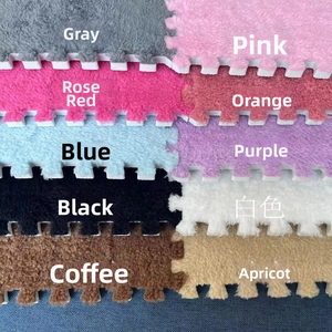 Detail of plush interlocking foam mats showcasing various colors and puzzle edge textures