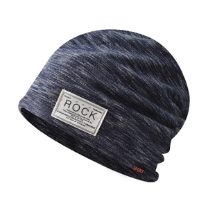 Detail of navy knit beanie fabric with ROCK patch and orange SPORT embroidery