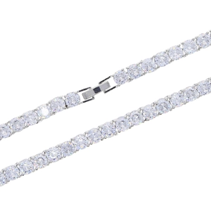 Macro view of a 5mm silver tennis chain with round clear zircons and a secure fold-over clasp