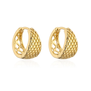 Macro shot of gold hoop earrings with diamond textured finish and hollow grid detail