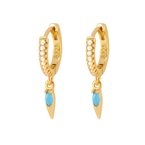 Close-up of S925 silver stamp on gold plated earrings with marquise blue gemstone