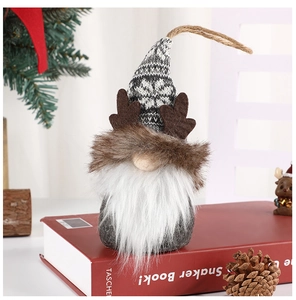 Close-up of a Christmas gnome ornament with reindeer antlers and knit snowflake hat