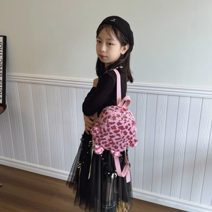 Pink leopard print plush backpack for girls with soft furry texture and nylon straps