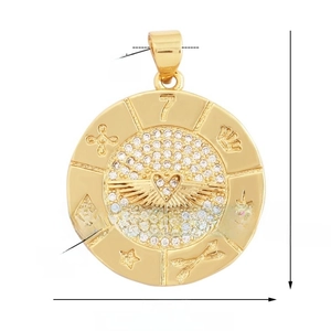 Macro detail of round golden zircon pendant featuring engraved crown and star symbols
