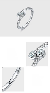 Detailed view of S925 sterling silver ring with twin hearts and bezel-set zircon stones