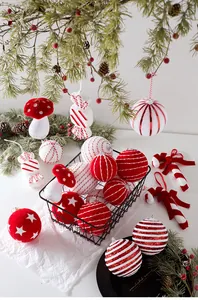 Detail of red and white Christmas ornaments set including striped candy and mushroom shapes
