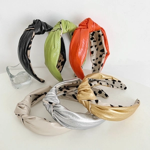 Assorted knotted faux leather headbands in metallic gold silver and solid neon colors