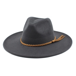 Detail view of dark grey wool fedora hat featuring a brown braided leather band with tassels