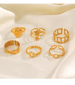 Detailed view of six 18K gold plated adjustable rings with star and moon motifs