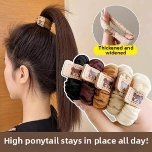 Detail of high-elastic thick scrunchies in five colors with cute cartoon bear leather tags