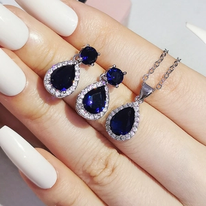 Elegant silver jewelry set with blue pear-cut zircon pendant necklace and stud earrings