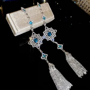 Elegant silver tassel earrings with blue marquise crystals and geometric cutouts