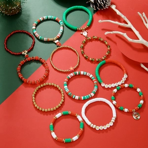 Set of 12 Christmas clay bead bracelets with Santa charms and festive pendants