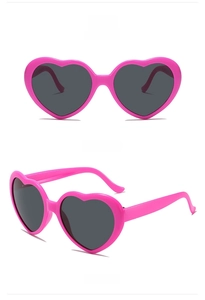 Front and 45-degree side view of heart-shaped rose red sunglasses with dark lenses