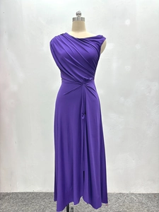 Detail of purple sleeveless pleated maxi dress featuring high-waisted gathered fabric