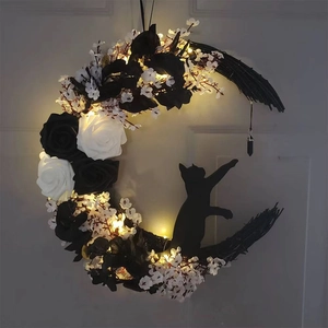 Gothic crescent moon cat wreath with black roses and warm LED lights for wall decor