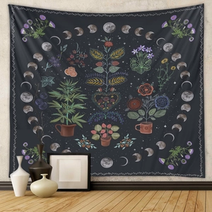 Detailed botanical moon phase tapestry hanging in a cozy room with floral illustrations