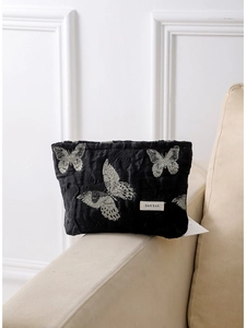 Elegant black cosmetic bag with silver butterfly embroidery and branded label