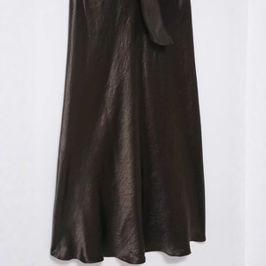 Elegant deep brown satin dress featuring a luxurious glossy finish and V-neck long sleeves