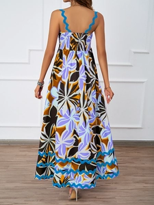 Detail view of smocked back design and blue wavy straps on floral summer maxi dress