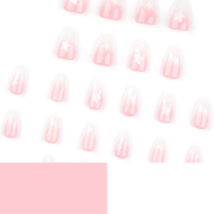Pink and white ombre press-on nails with white star designs in a complete manicure set
