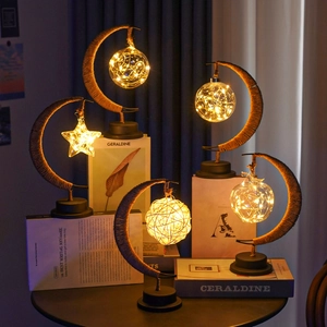 Macro detail of crescent moon desk lamps with LED warm lights and hemp rope winding