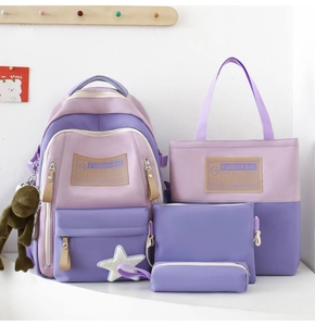 Four-piece school bag set in purple patchwork including backpack, tote, and pouch