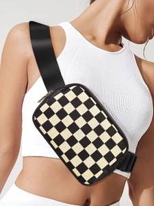 Close-up of checkerboard crossbody bag with durable nylon strap and plastic buckle detail