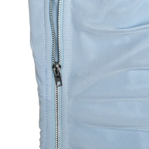 Close-up of side metal zipper and blue mesh fabric on the high-waist bodycon skirt
