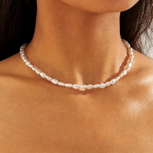 Detail of baroque pearl necklace showing natural irregular texture and warm luster