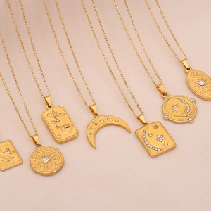 Golden stainless steel celestial necklaces featuring sun, moon and star pendants