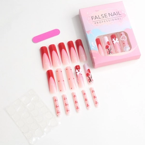 Pink and red press-on nail kit with heart, cherry, and bow designs and tools