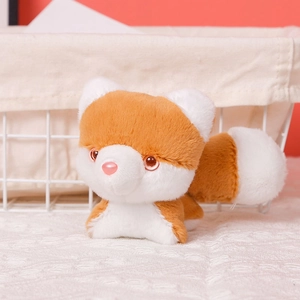 Close-up of cute plush husky keychain with fluffy tail and soft orange fur texture