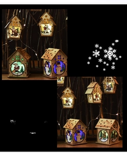 Detail of wooden Christmas house ornaments with laser-cut patterns and colorful LED lights