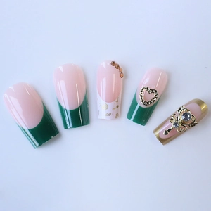 Classic green French press-on nails with heart diamonds and luxury crown accessories