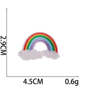 Detail view of rainbow cloud embroidery patch showing 4.5cm width and 2.9cm height