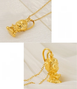 Macro shot of 3D Sun Wukong pendant in gold plated stainless steel showing fine details