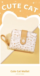 Close-up of a cute cat themed short wallet with cartoons and yellow wrist strap
