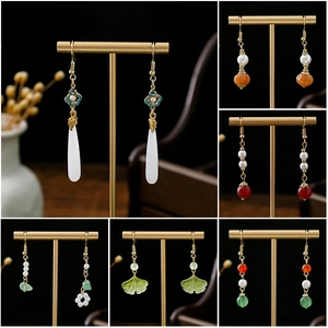 Collection of Neo-Chinese gold earrings with hollow flower beads and long tassels