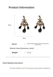Detail shot of vintage palace style earrings with black crystals and long tassels