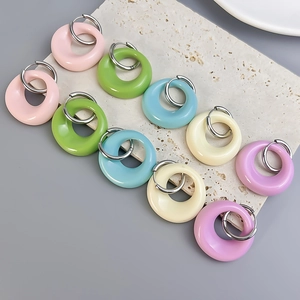 Colorful oval resin hoop earrings with 18K gold plated clasps in five candy colors