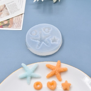 Translucent silicone mold for starfish and heart shapes with textured resin samples