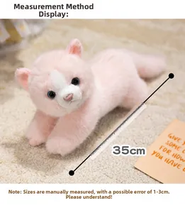 Detailed view of pink Persian cat plush showing 35cm length measurement on soft carpet
