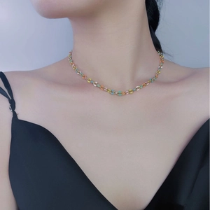 Colorful enamel link necklace in bohemian style on model with gold-plated finish