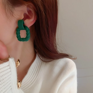 Vintage dark green twisted acrylic square stud earrings for women on model ear