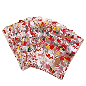 Bulk clear plastic Christmas treat bags with festive Santa and reindeer cartoon patterns