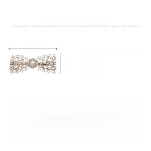 Detail of star-shaped rhinestone bow hair clip with a large pearl center on white base