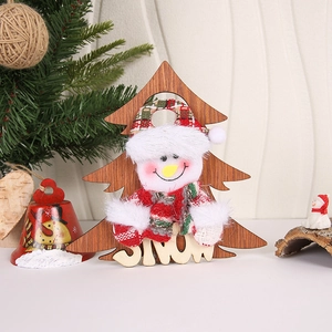 Macro detail of wooden Christmas tree decor with plush snowman and SNOW letter carving